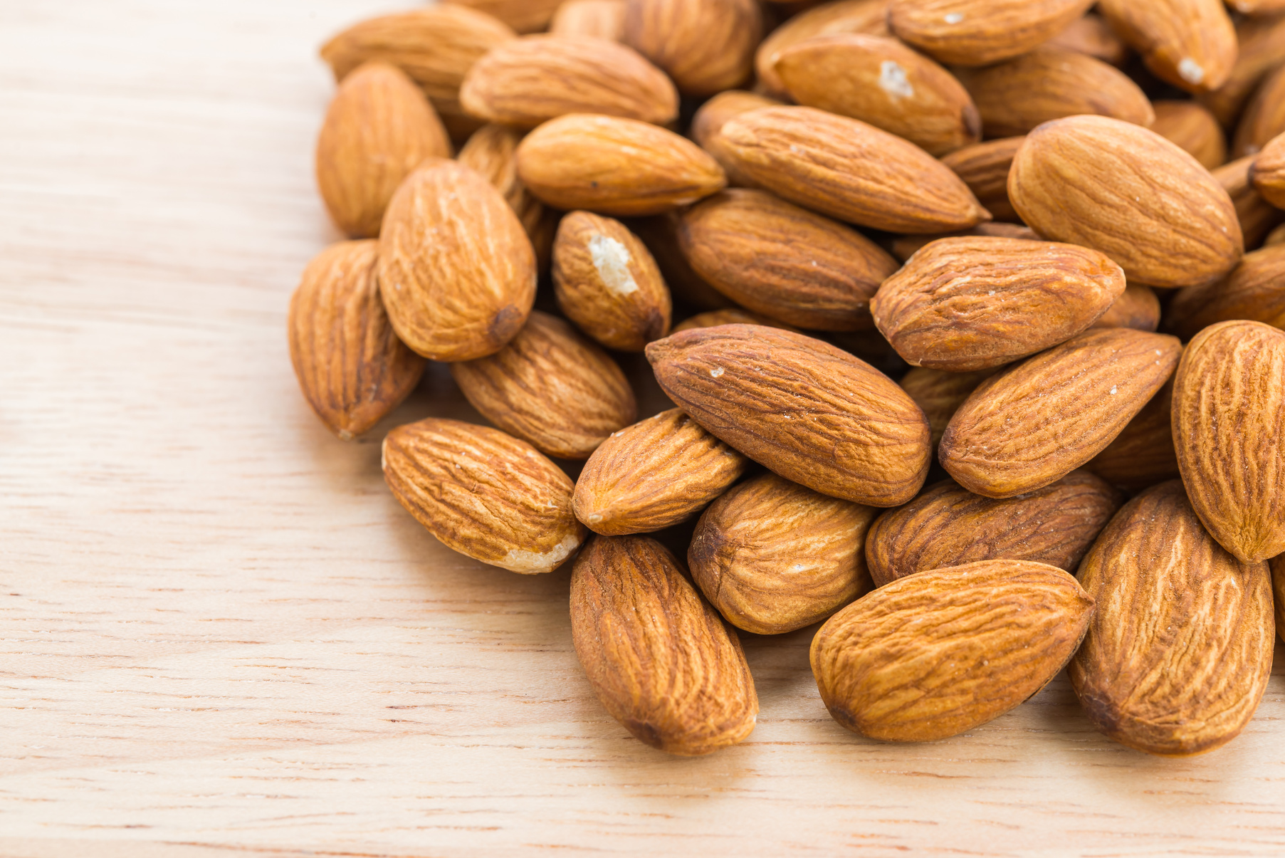 Almond on Wooden Background